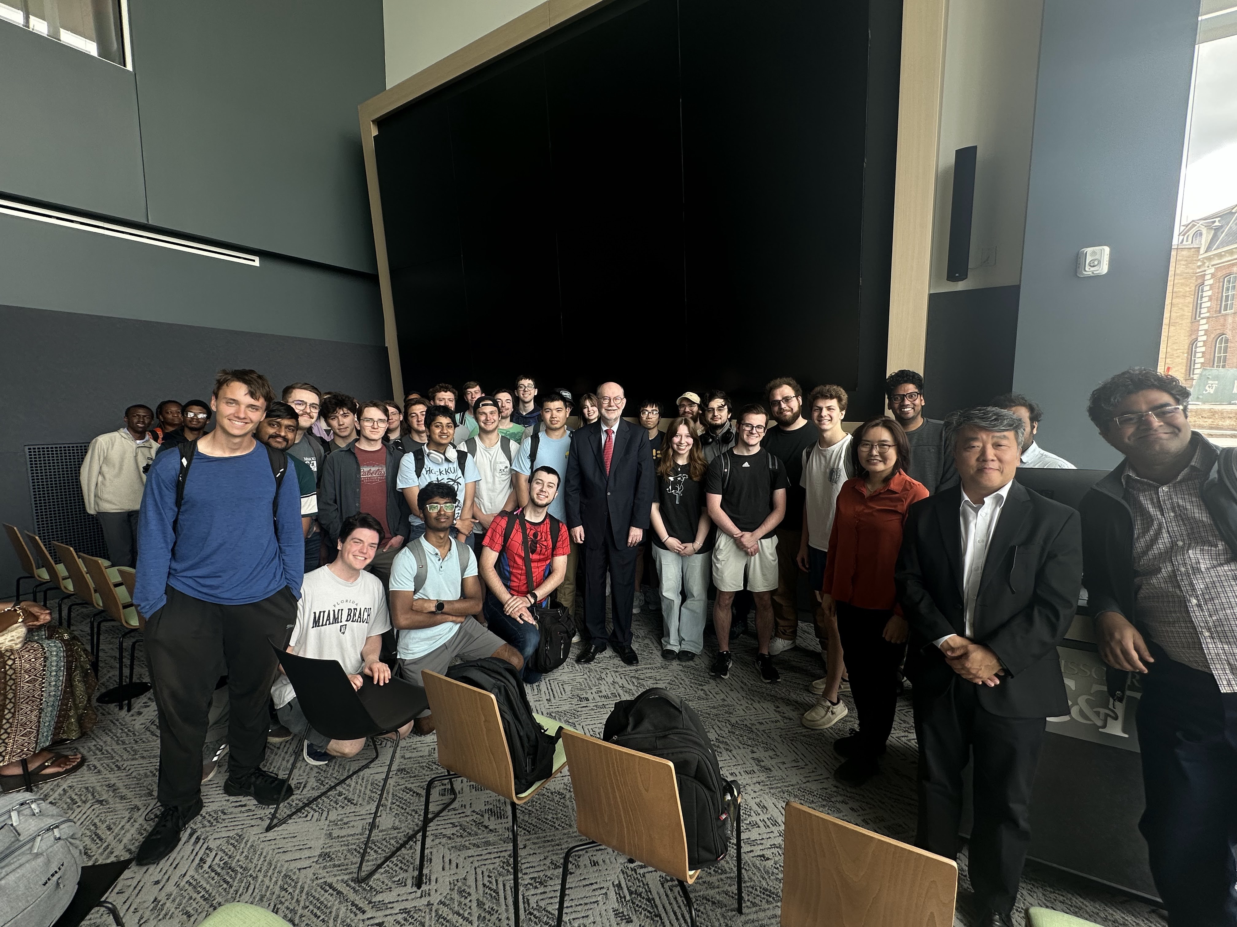 group of students, faculty and Daniel Reed
